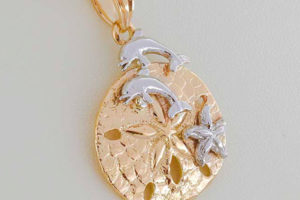 A sand-dollar with a Dolphin Couple and a Starfish Pendant