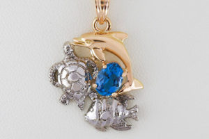 A Dolphin, Turtle, and Angel Fish Pendant