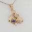 Ocean-Inspired Pendant in Gold with Dolphin, Seahorse, Angelfish & Blue Sapphire