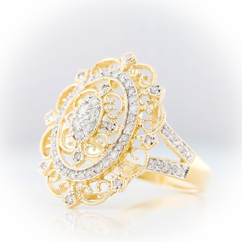 Ornate vintage-style gold filigree ring with diamonds and openwork design