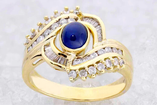 Blue Cabochon Eye-Inspired Ring with Baguette and Round-Cut Diamonds